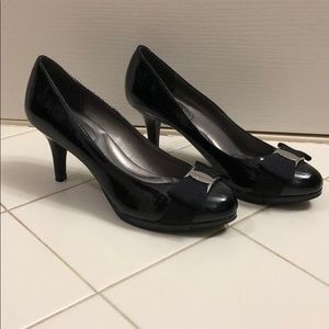 Black heels with silver clasp and bow